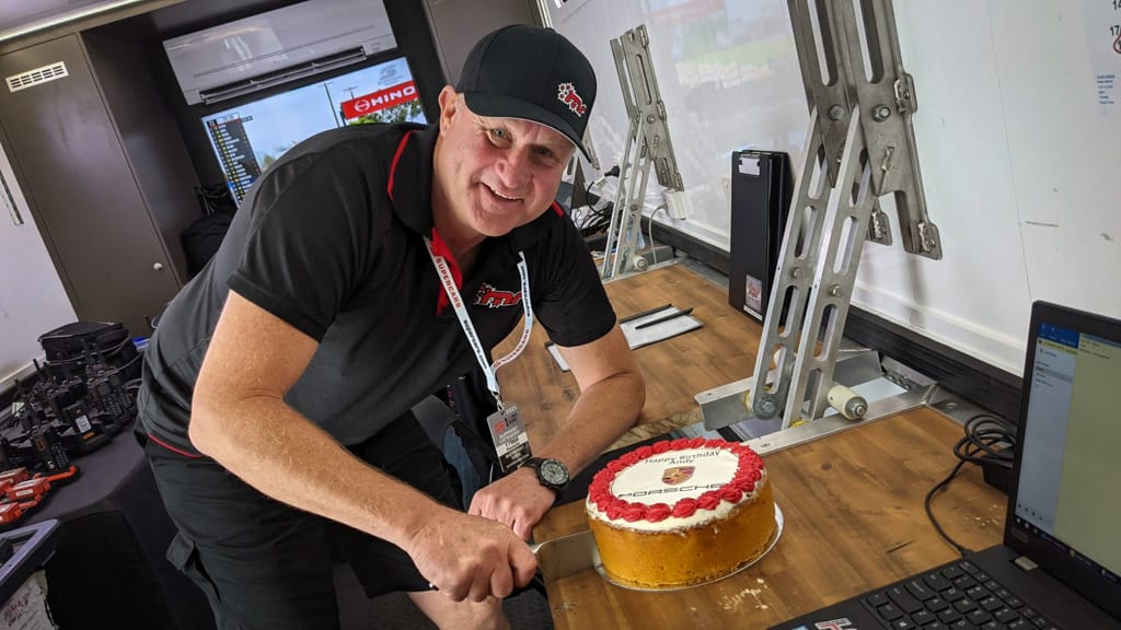 Andy McElrea cutting cake at Mount Panorama Circuit Bathurst 2021
