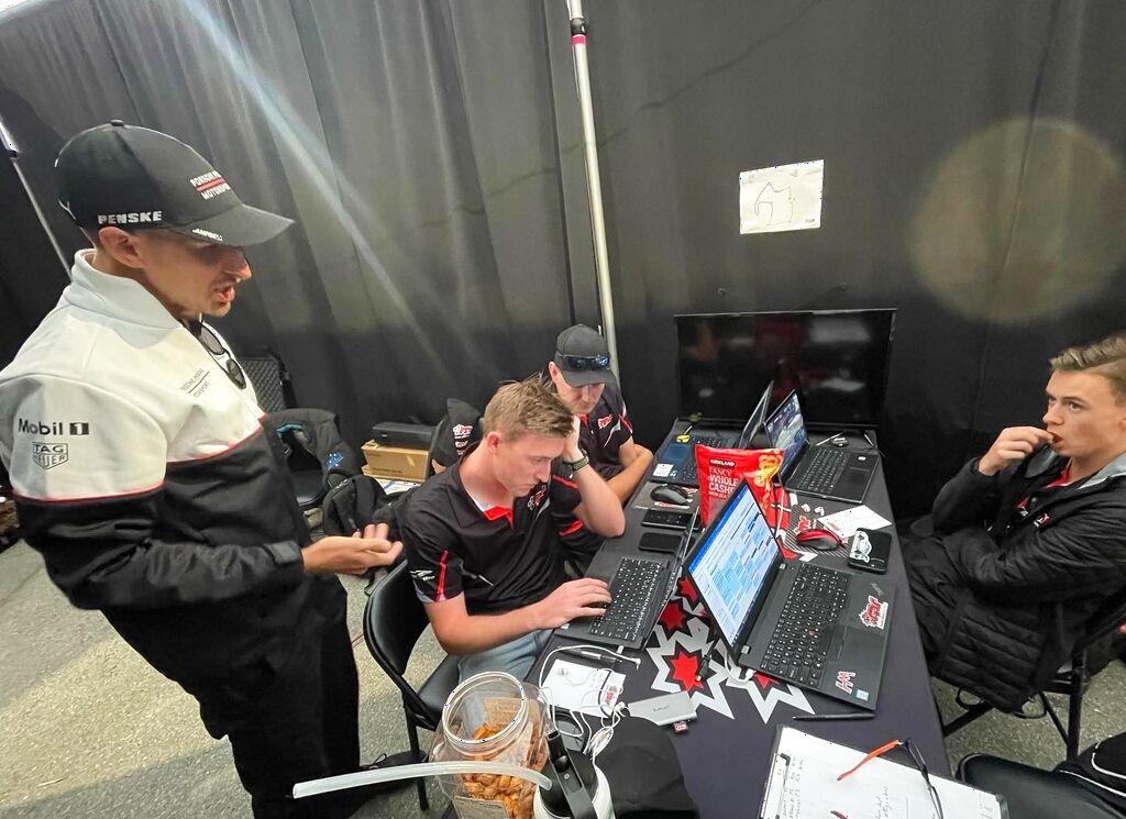 Matt Campbell gives some advice to the McElrea Racing drivers at Rennsport Reunion 7 Laguna Seca 2023